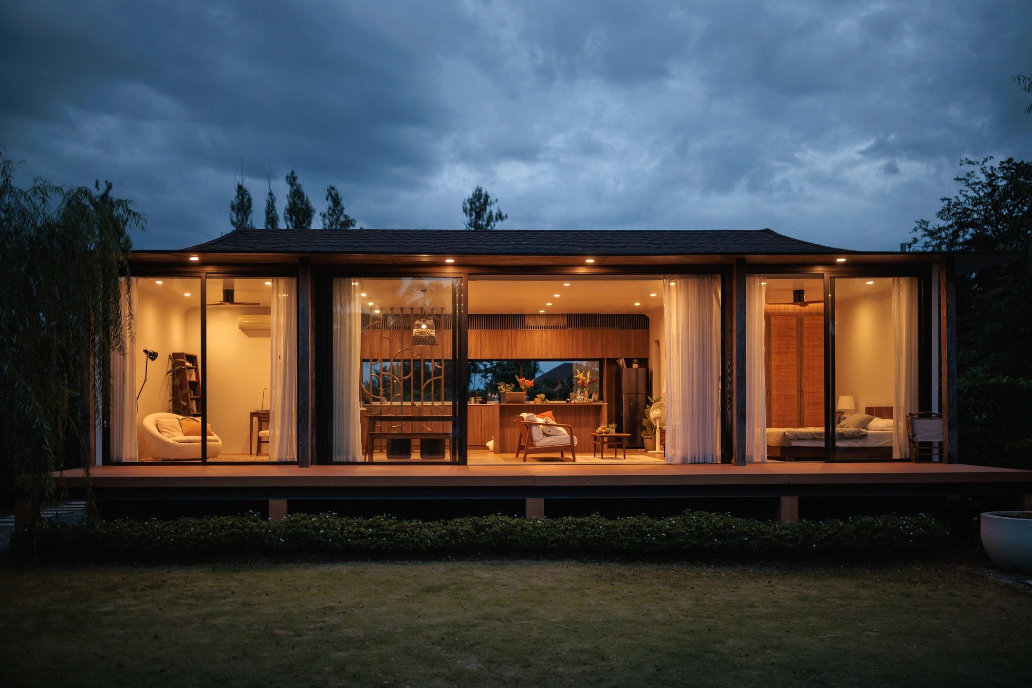Warmly lit lodge exterior at dusk