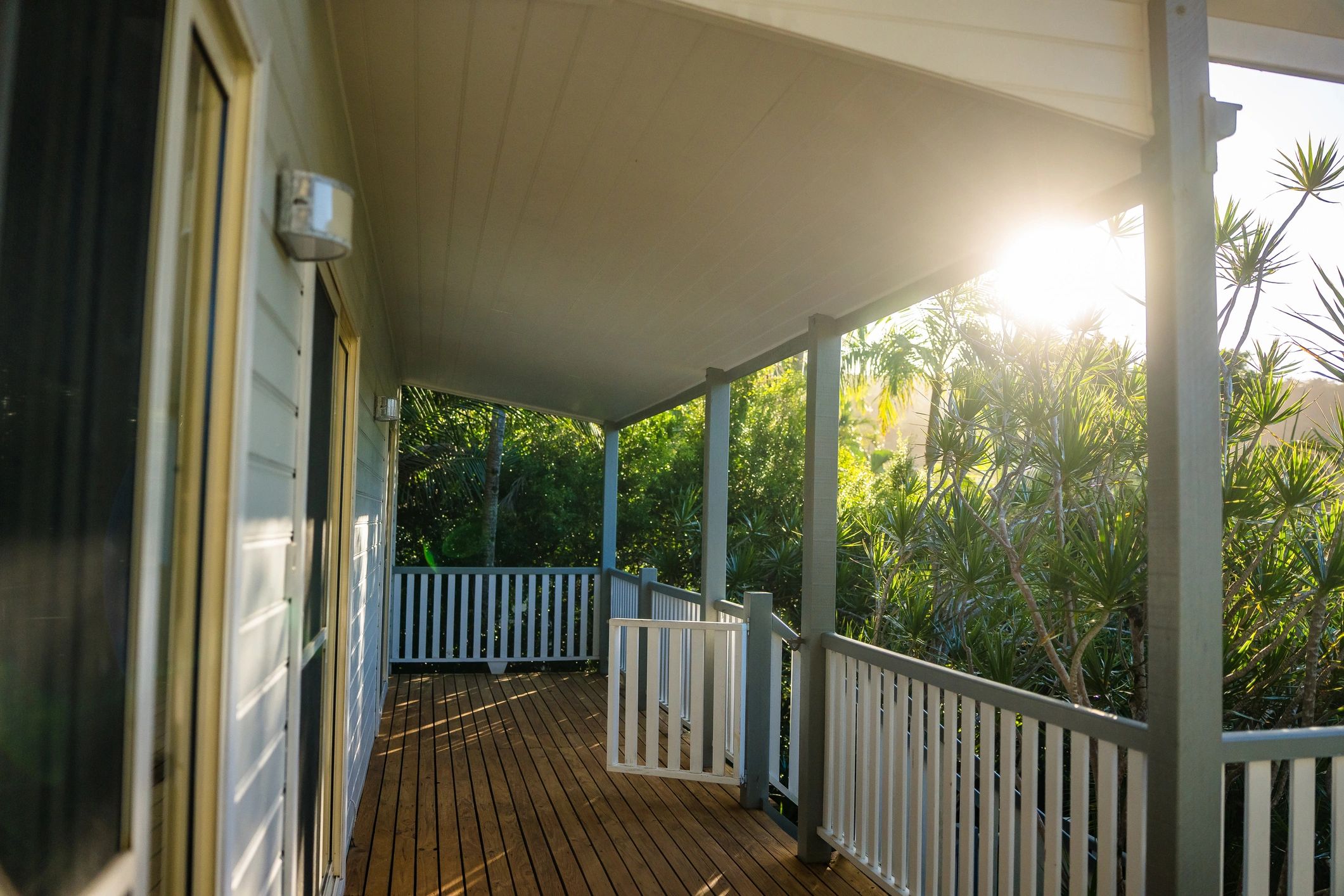 Sunlit covered porch at a lodge